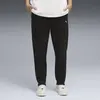 Puma EVOSTRIPE Sweatpants DK op Siyah Kadın Eşofman Altı