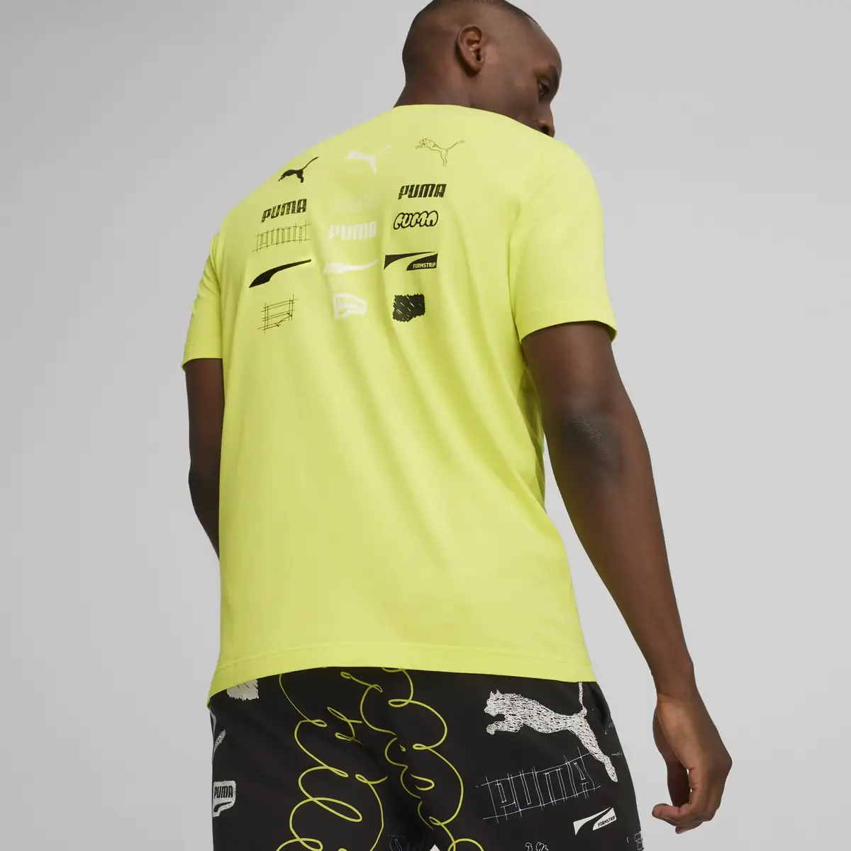 Puma BRAND LOVE Graphic Tee Sarı Erkek T-Shirt & Polo