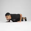 PUMA M GRAPHICS TRAIN RELAXED TEE Siyah Erkek T-Shirt