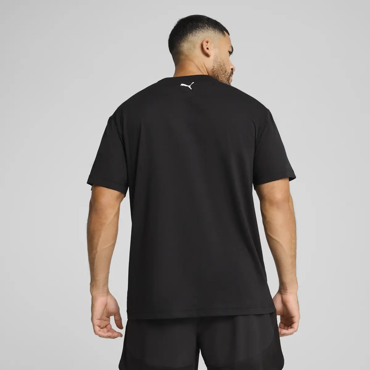 PUMA M GRAPHICS TRAIN RELAXED TEE Siyah Erkek T-Shirt